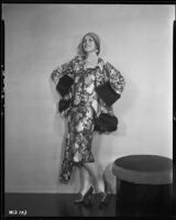 Peggy Hamilton modeling suit in a floral patterned silk with fur trim, circa 1930