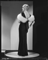 Peggy Hamilton modeling a black velvet dinner gown, 1933