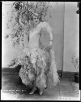 Peggy Hamilton modeling a garden frock of alice blue and green tulle, 1928