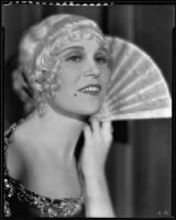 Peggy Hamilton posing with an open fan, 1930