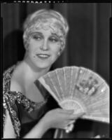Peggy Hamilton posing with an open fan, 1930
