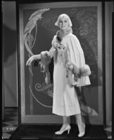 Peggy Hamilton modeling a cape of her own design of cream corded henrietta cloth, 1931