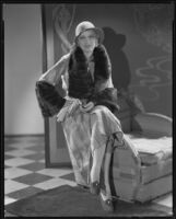 Actress Noel Francis modeling a fur coat, circa 1931