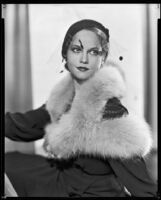 Actress (?) modeling a fur-trimmed dress, circa 1931-1933