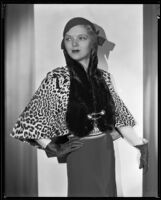 Actress (?) modeling a fur stole, circa 1931-1933