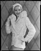 Actress (?) modeling a fur jacket, circa 1931-1933