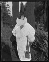 Actress (?) modeling an ermine (?) coat, circa 1930-1931