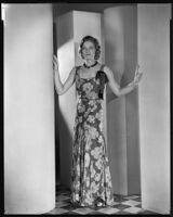Actress Natalie Kingston modeling an evening gown from a Walter Switzer shop, 1930