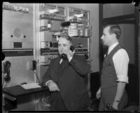 Los Angeles Mayor Frank Shaw and G.H. Bishop in television or radio studio, [Los Angeles?], 1933-1938