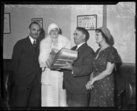 Los Angeles County Supervisor Frank Shaw with re-election petition certificates, [Los Angeles?], 1932