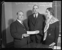 Los Angeles County Supervisor Frank Shaw, George Cuthbert, and Rheba Crawford Splivalo with check, 1933