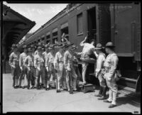 Marine Reservists boarding train at train station, 1933