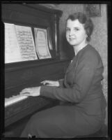 Opera singer Marion Talley at piano, 1933