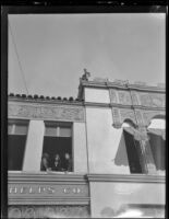 Rose Parade spectators in 2nd floor window at 42 W. Colorado Blvd., Pasadena, 1930