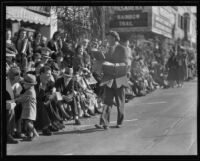 Street vendor offering small hand-made wooden chairs to spectators on the route of the Tournament of Roses Parade, Pasadena, 1932