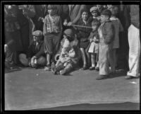 Families with young children on the route of the Tournament of Roses Parade, Pasadena, 1932