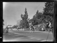 Three men on horseback in the Tournament of Roses Parade, Pasadena, 1935