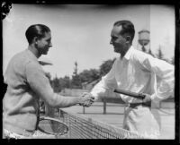 Tom Ferrandini and Harold Godshall shaking hands on tennis court, Midwick Country Club, Alhambra, 1925