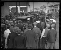 Crowd gathers around stunt driver Hayward Thompson’s car, Los Angeles, 1927