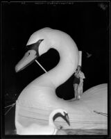 Valerie Schmidt rides Santa Barbara’s swan float at the Tournament of Lights, Newport Bay, 1934
