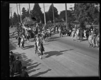 Float and equestrians in the annual Rose Parade, Pasadena, 1910-1920