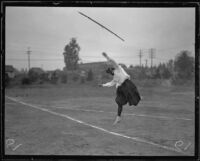 Woman athlete throws a javelin at a UCLA women's track meet, Los Angeles, 1921
