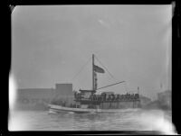 Small commercial passenger boat sails along, San Pedro, 1932