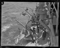 Sailors man a gun aboard the USS West Virginia during Navy training maneuvers, 19245-1939