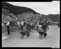 Day laborers use shovels and wheelbarrows to widen the road through Griffith Park, Los Angeles, 1933