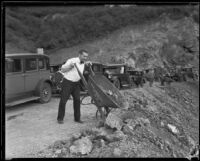 A day laborer dumps rocks from a wheelbarrow in Griffith Park, Los Angeles, 1933