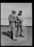 Sailor assigned to work on the P2Y-1 seaplane speaks with a civilian, 1934