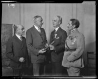 USC President Dr. Rufus B. von Kleinsmid receives a diploma from French Consul Henri Didot, Los Angeles, 1928