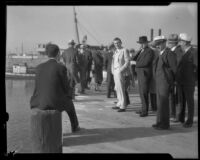 William James (Curly) Guy, Superior Judge Robert W. Kenny and others stand on a wharf, Los Angeles, 1933