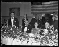 Frederick P. Woellner, Milo Bekins, Eloise Bekins, and Frank F. Merriam at a banquet, Los Angeles, 1933