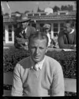 Golfer Craig Wood posing in front of a clubhouse, Los Angeles, 1930s