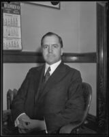 Judge H. Parker Wood poses in his office, Los Angeles, 1933