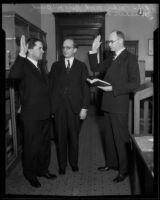 Judge H. Parker Wood is sworn in by Judges Marshal F. McComb and Guy F. Bush, Los Angeles, circa 1933