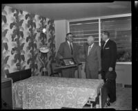 Three men conversing in a hospital room possibly in relation to a catastrophic flood and mudslide, La Crescenta-Montrose, 1934