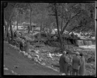 People gather in a flood-damaged and debris-strewn Little Santa Anita Canyon, Sierra Madre, 1926