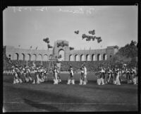 Band of the Fighting Irish marches onto the field during halftime of the USC and Notre Dame football game, Los Angeles, 1928