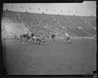 USC Trojan No. 18 dodges a Utah defender near the 50-yard-line in the USC and Utah football game, Los Angeles, 1932