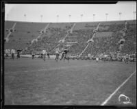 Players jostle for position near the 55-yard-line during a football game between UCLA and St. Mary's, Los Angeles, 1934