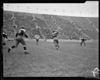St. Mary's player catches a pass during a football game between UCLA and St. Mary's, Los Angeles, 1934
