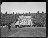 USC's rooting section spells out "We Greet You" in the stands during the USC and Notre Dame football game, Los Angeles, 1928