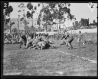 Football players pile up near the end zone during a game between the Oxy Tigers and the Whitter Poets, Whittier, 1925