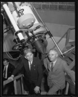 Dr. Philip Fox and Dr. W. F. Meyer pose next to the Zeiss refracting telescope telescope at Griffith Observatory, Los Angeles, 1935