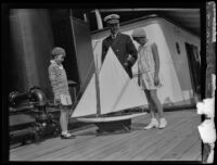 Captain Hamma watches as two young girls admire a model ship, San Pedro (Los Angeles), 1930