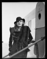 Ketti Gallian outside of an airplane, between 1929-1939?