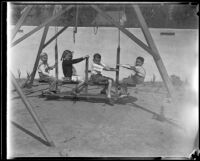 Gettle children play on their swing set during William F. Gettle's kidnapping ordeal, Beverly Hills, 1934