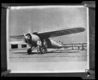 Art Goebel beside his monoplane probably at Mines Field, Los Angeles, circa 1928